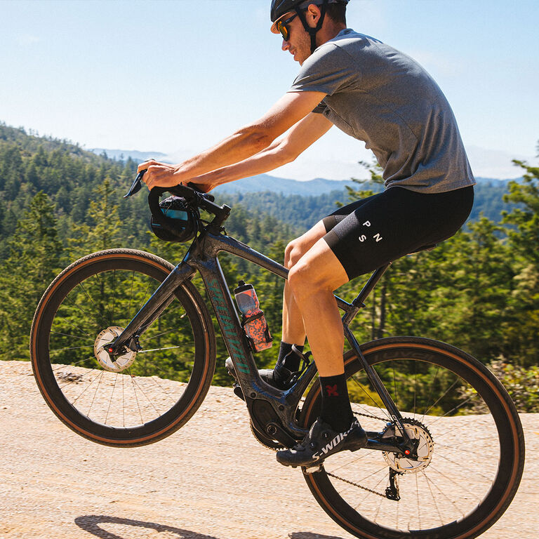 man doing a wheelie on mountain bike